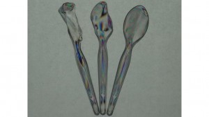 The stochastic stress-induced birefringence within plastic spoons left in the hot sun is visualized through polarization-filtered coloration The spoons are placed between a pair of co-aligned polarizer sheets in an open-gate arrangement, with a backing of