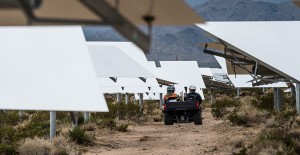 Maintenance workers drive between the heliostats at the Ivanpah concentrating solar energy plant, where mirrors track the sun and reflect sunlight to boiler receivers on power towers When the concentrated sunlight strikes the boiler pipes, it heats the wa