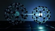 llustration showing light exciting electrons in two molecules of the organic semiconductor known as buckminsterfullerene The newly formed exciton shown by the bright dot is first distributed over two molecules before it settles on one molecule shown on th
